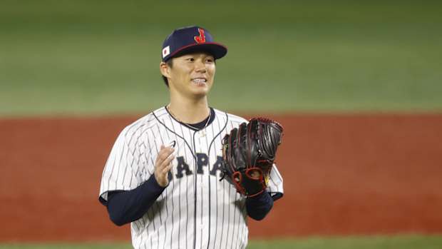 Aug 4, 2021; Yokohama, Japan; Team Japan pitcher Yoshinobu Yamamoto (17) reacts against Korea in a baseball semifinal match during the Tokyo 2020 Olympic Summer Games at Yokohama Baseball Stadium. Mandatory Credit: Yukihito Taguchi-USA TODAY Sports  